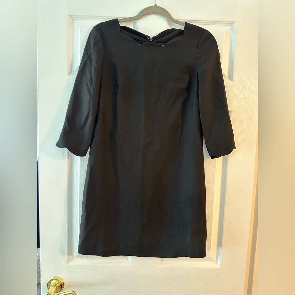 Black peplum neckline dress